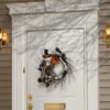 National Tree Company Artificial Skeleton's Halloween Wreath, Decorated With Branches, Orange And Black Trim, Berry Clusters, Assorted Leaves, 24 In